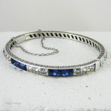 Art Deco Sapphire Blue & Clear Paste Bangle Bracelet, Channel Set Square Paste in Floral Engraved Sterling Silver Bangle, Circa 1920s.