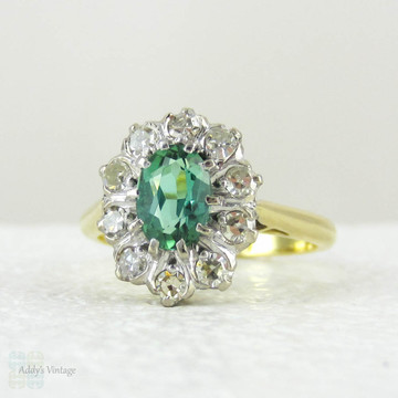 Vintage Green Tourmaline Ring with Diamond Halo, 18 Carat Gold Engagement Ring or Dress Ring, Circa 1940s.