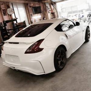 Nissan 370Z 2009-2020 Nismo V2 Style 1 Piece Polyurethane Rear Bumper - image 1