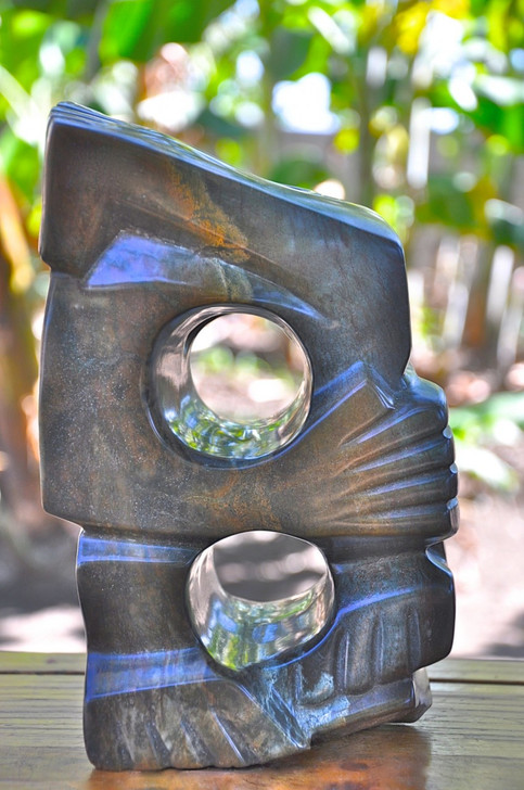 Shona Sculpture 'Sitting Alone' by David Chikuzeni. Sculpted from fruit serpentine stone.