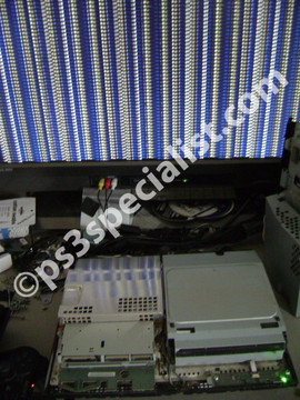 The console connected to a TV and ready for disassembly