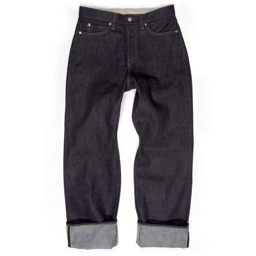 Front view of Japanese denim brand Momotaro's wide fit (#400) big men's jeans, which are cuffed and feature a wide-leg silhouette and button-fly closure. The dark indigo blue style MMJB0400 is a selvedge jean with a high-mid rise displayed on a white background.