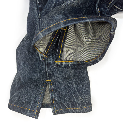 Close-up detail view of the split hem jeans alteration service by Williamsburg Garment Company, showing a professional split hem customization at the outseam with chainstitch hemming.