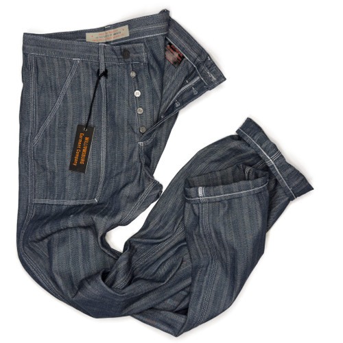 A close-up detail view of Williamsburg Garment Company tall men’s jeans with open button-fly, white triple-stitching, and 40-inch inseam, made in the USA herringbone denim workwear.