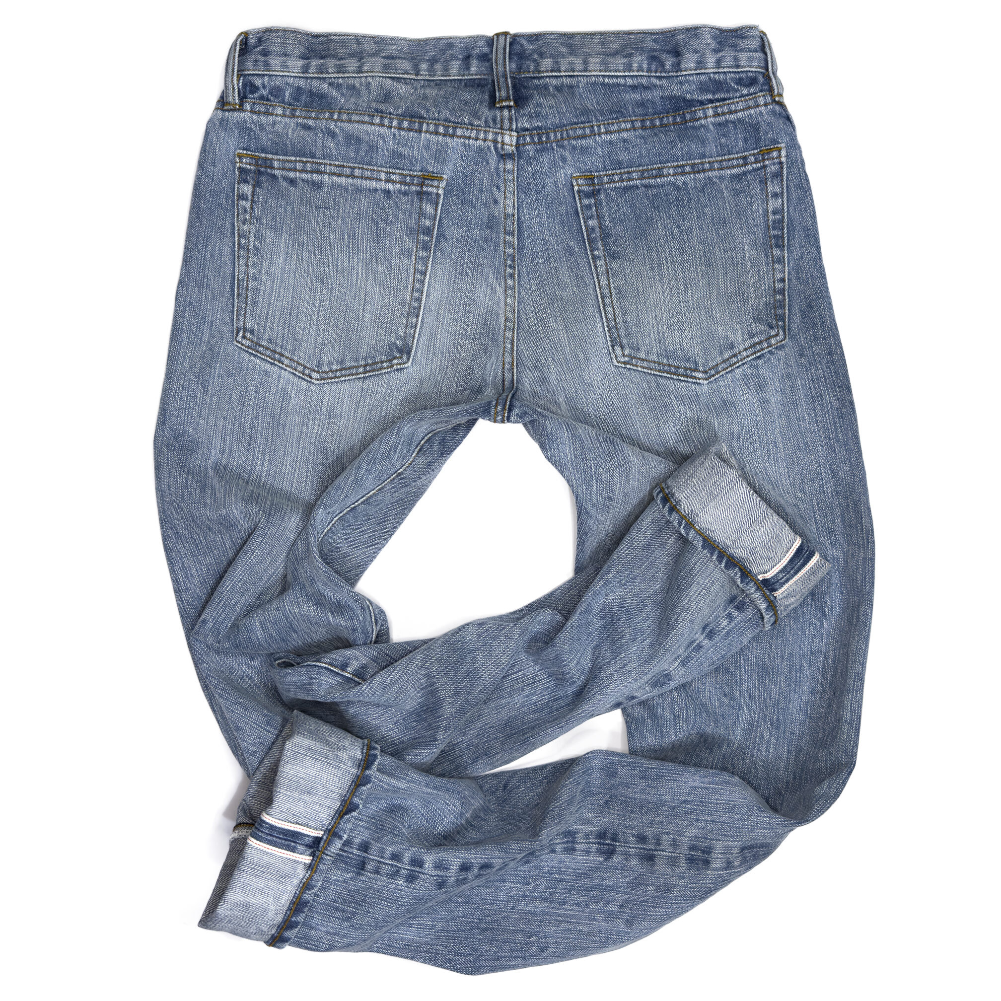 Rear view of Williamsburg Garment Company’s custom jeans in light blue stonewashed selvedge denim with unbranded back pockets, designed for tall men.