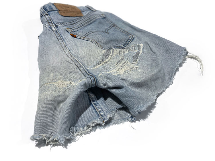 Women's cut-off jean shorts with denim repairs represents our gallery of work repairing jean holes