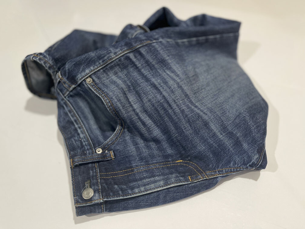 A view of the exterior side of J. Crew jeans, which had broken zipper teeth that were repaired by replacing the entire zipper and sewing the front panel back together to match the original jeans' sewing.