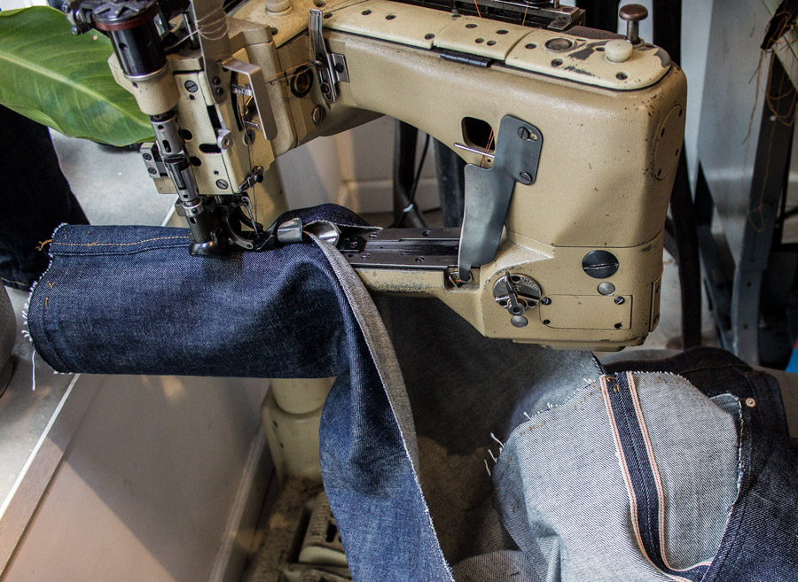 Sewing a flat-felled seam on selvedge jeans with a Union Special 35800 feed-off-the-arm sewing machine