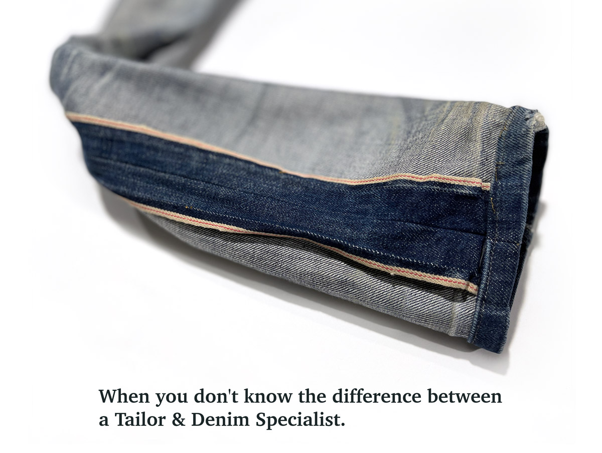 An inside, close-up view of the outcome of bad denim tailoring shows the selvedge outseam on a pair of Gustin jeans that was poorly tapered at the outseam, resulting in a broader than-normal selvedge detail. The text under the image reads "When you don't know the difference between a Tailor and Denim Specialist."