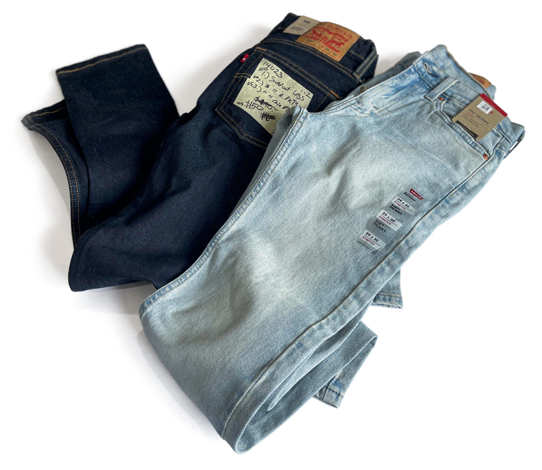 Two pairs of men's Levi's 510 skinny jeans before alterations and customizing by Williamsburg Garment Company, displayed on a white background.