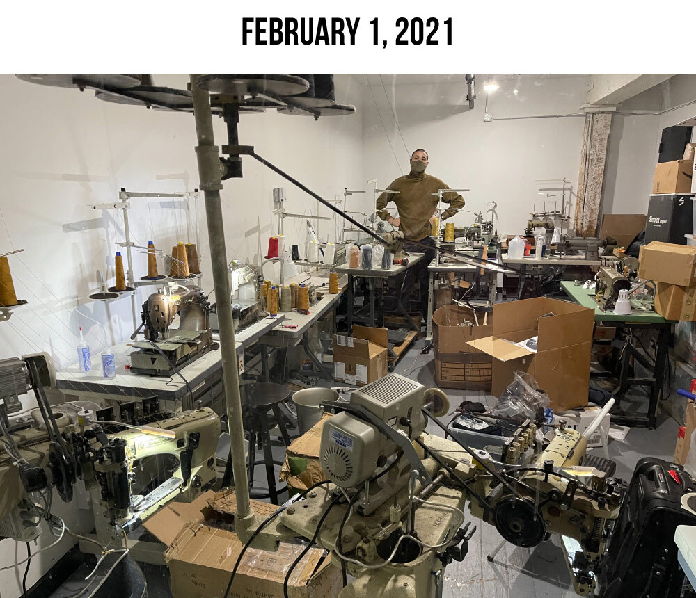 Williamsburg Garment Company new 500 square foot studio at 67 West Street Suite 340 on February 1 2021 showing industrial sewing machines and staff member Israel Giles.