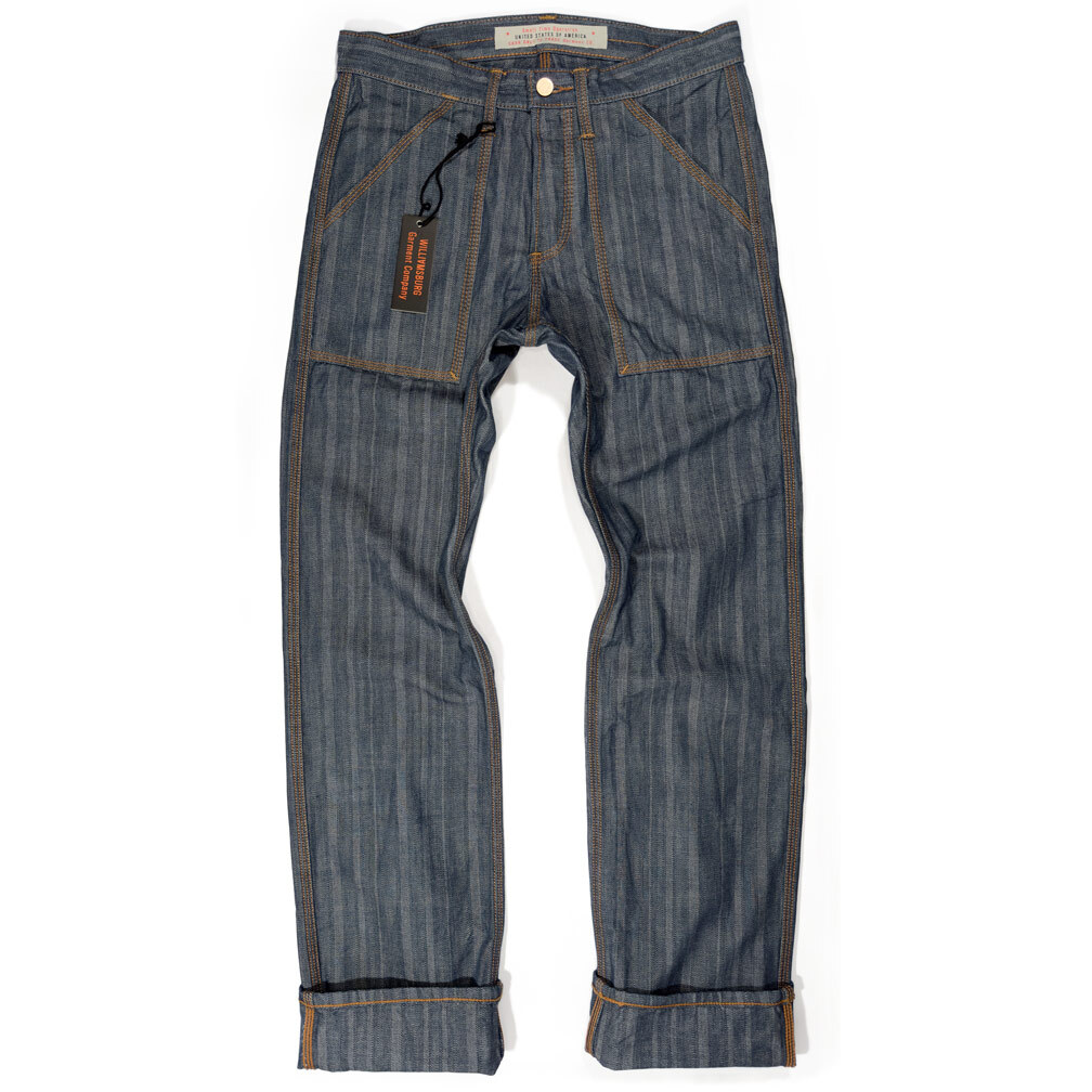 The front view of a pair of men's patch pocket work jeans made in the USA in herringbone denim with heavy burnt orange triple-stitching represents the link to the Williamsburg Garment Company's men's fit guide.