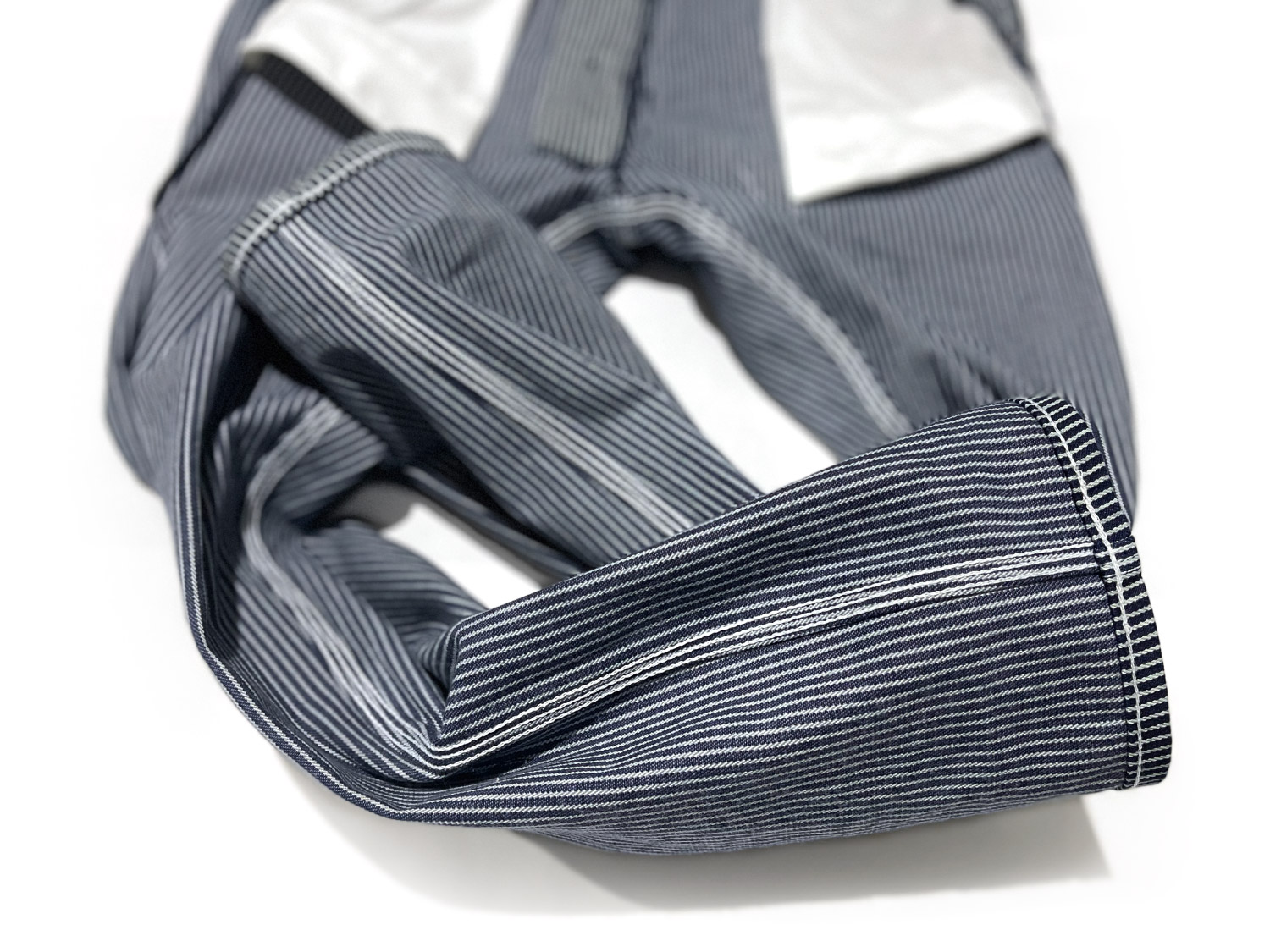 The inside view shows how overalls with 3-needle chain stitch sewing are tapered with same-as-original construction.