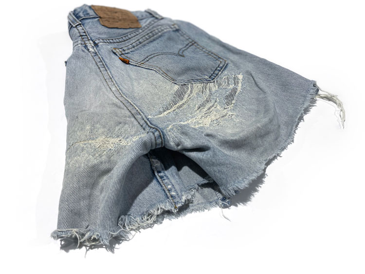 Ripped Levi's cut-off jean shorts with holes repaired