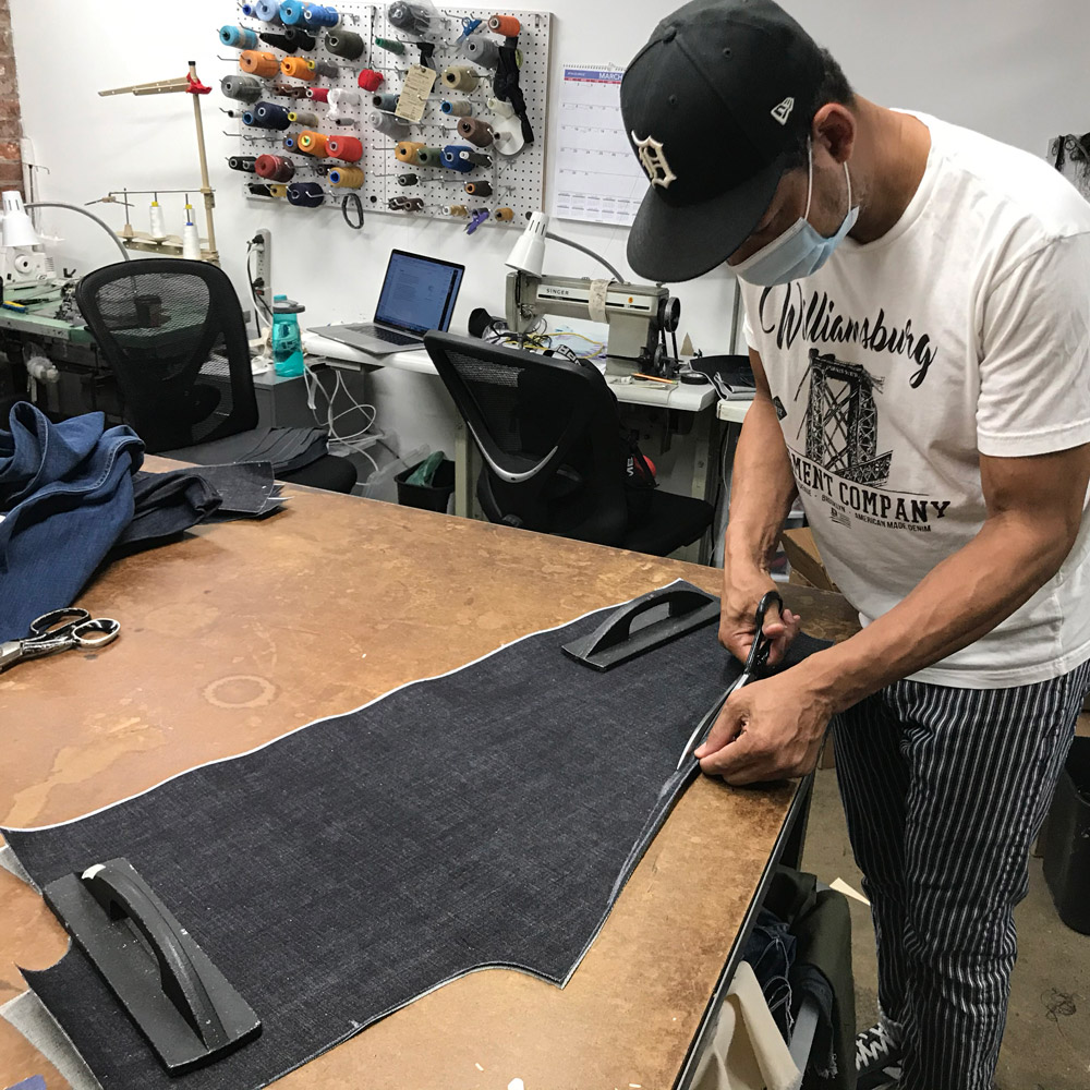 Denim designer Maurice Malone hand cuts denim for bespoke jeans at his Williamsburg workshop.