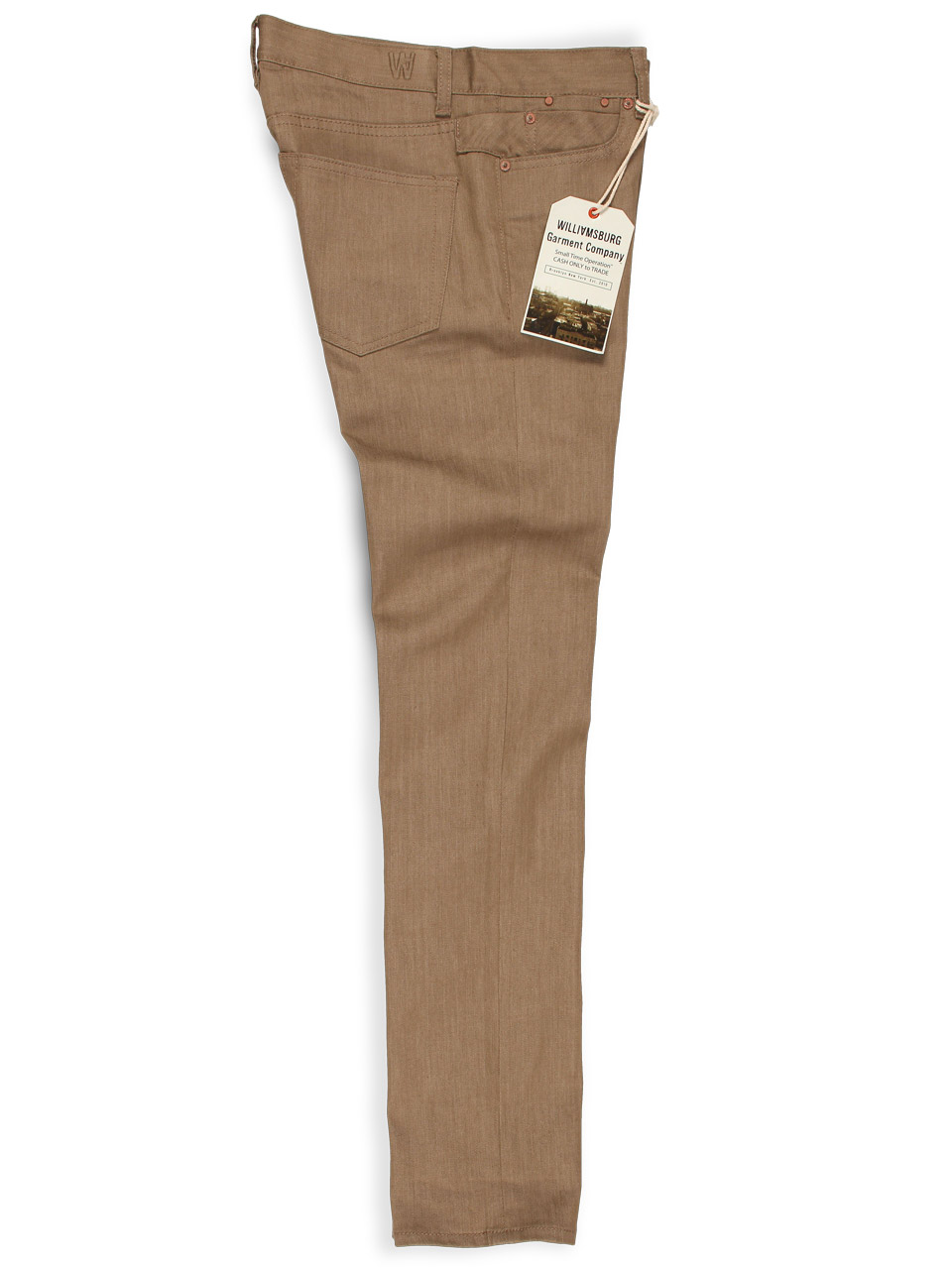 Side view of tan stretch raw denim skinny jeans for men