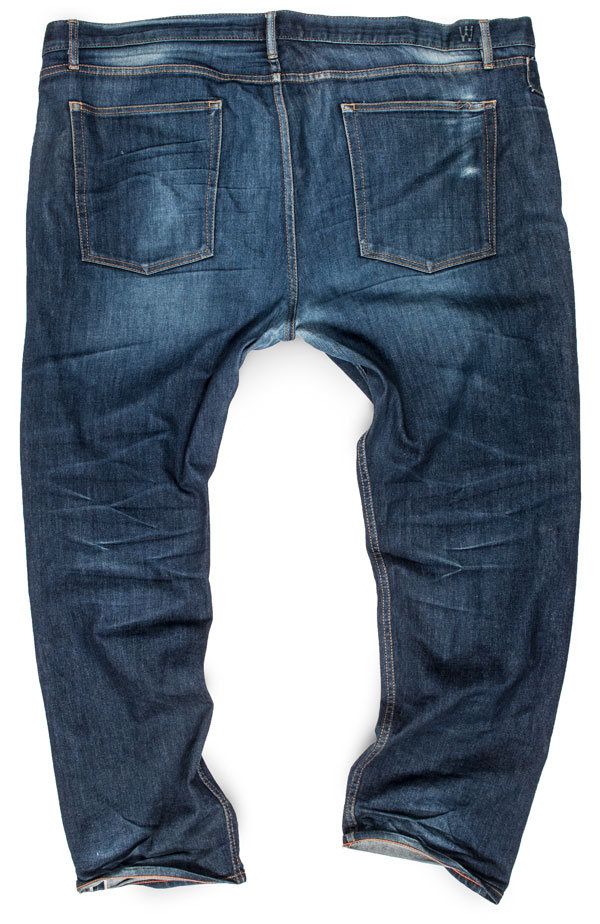 Rear view of old faded stretch raw denim selvedge size 48 jeans for big men.