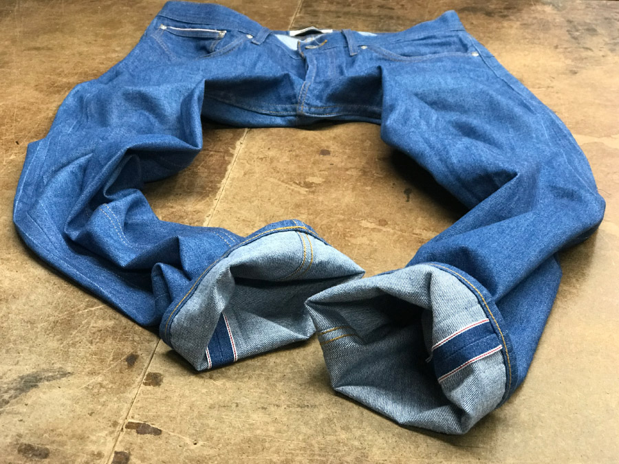 After the hem is sewn, the selvage has been restored to its original size and the repair of bad tapering alterations on this pair of Naked & Famous jeans is complete.
