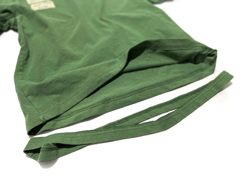 Close-up sewing details show how we hem t-shirts that matc the original construction