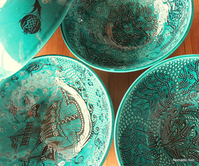 30cm handmade and hand painted ceramic bowls.  In a deep jade green with black intricate details.