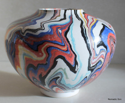 This incredible vase is a completely unique one off vase made by Elagoz (the only artist in the world to master Ebru on ceramics).  Sublime swirling patterns; a blend between the artist and the uncontrollable nature of Marbling.