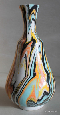 This incredible vase is a completely unique one off vase made by Elagoz (the only artist in the world to master Ebru on ceramics).  Sublime swirling patterns; a blend between the artist and the uncontrollable nature of Marbling.