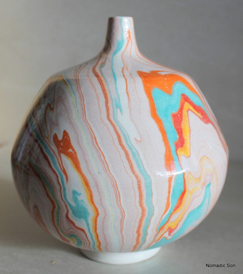 This incredible vase is a completely unique one off vase made by Elagoz (the only artist in the world to master Ebru on ceramics).  Sublime swirling patterns; a blend between the artist and the uncontrollable nature of Marbling.