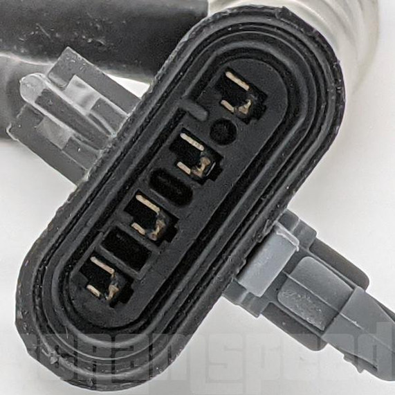 Scram Speed 1997–2002 Corvette Upstream O2 Oxygen Sensor – SNS122, close-up of the sensor's black connector with multiple metal pin terminals for automotive oxygen sensor connection.