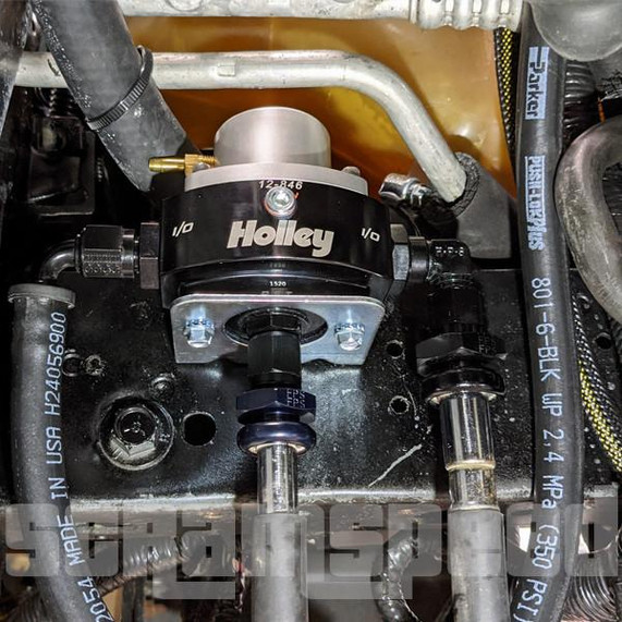 Scram Speed Fox Body Mustang Fuel Pressure Regulator Kit for Engine Swap or Aftermarket Rails, close-up view of the fuel pressure regulator mounted in the engine bay.