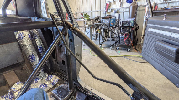 Scram Speed Window Net Kit, automotive safety window net installed inside a car during a restoration or modification project.