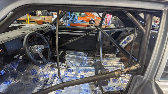 Scram Speed Window Net Kit, interior of race car with roll cage and installed window net kit