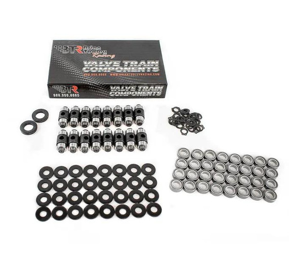 BTR LS & LT Rocker Arm Trunnion Kit - TK002, automotive engine component parts including trunnions, washers, and small hardware pieces laid out with a box in the background.