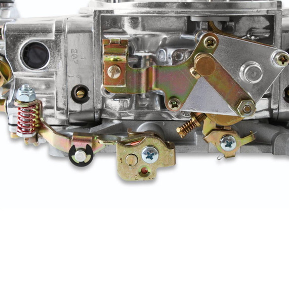 Holley Performance Parts – EFI, Intakes, & More Holley 0-4779S MODEL 4150 750CFM Carburetor, close-up of metallic carburetor components with mechanical linkages and adjustment screws.