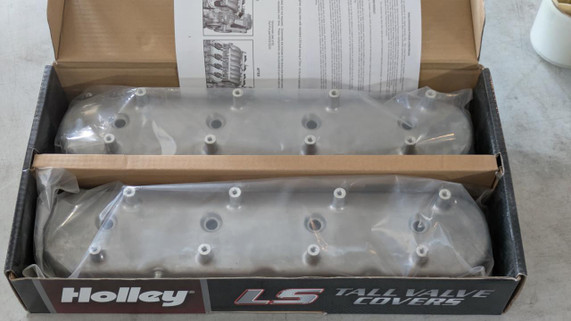Holley Performance Parts – EFI, Intakes, & More Holley 241-95 Dry Sump Valve Covers, boxed set of two aluminum valve covers with bolt holes, wrapped in plastic and included installation instructions.