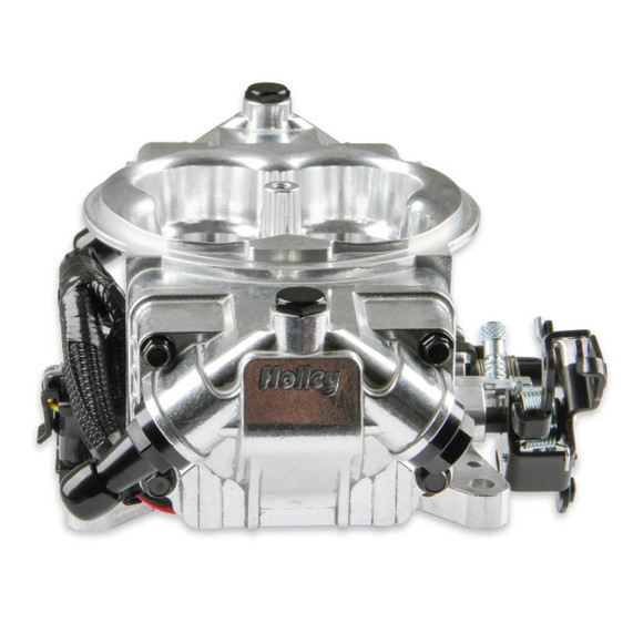 Holley EFI Holley 550-1011 Terminator X Max Stealth with trans control, an automotive electronic fuel injection system with a sleek metallic design and multiple connection ports for engine management.