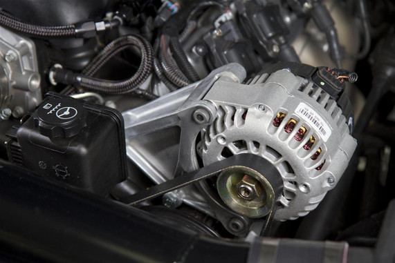 Holley Performance Parts – EFI, Intakes, & More LS Accessory System - P/S and Alt Bracket, close-up of engine components with alternator, pulley, and wiring.