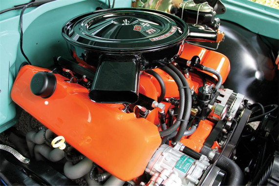 Holley Performance Parts – EFI, Intakes, & More Holley LS Coil Covers - Composite, close-up view of a high-performance car engine with vibrant orange valve covers and black coil covers.