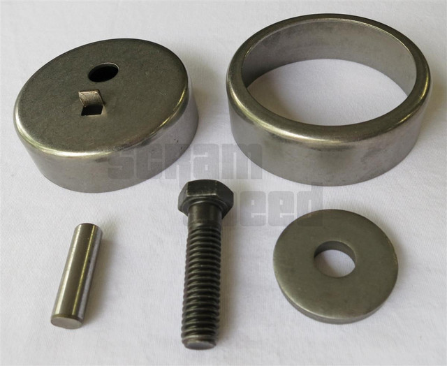 Scram Speed Small Block Ford Mechanical Fuel Pump Eccentric Kit, metal components including a large ring, a small disc, a bolt, a pin, and a washer laid out on a white background. Scram Speed Small Block Ford Mechanical Fuel Pump Eccentric Kit, metal components including a large ring, a small disc, a bolt, a pin, and a washer laid out on a white background.