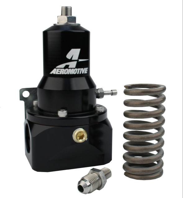 Aeromotive High-Performance Fuel System Parts Aeromotive 13132 Pro Mod EFI Gear Pump Regulator with adjustable pressure from 30 to 120 psi, featuring a .500 valve, two AN-10 inlets, and an AN-10 bypass, displayed alongside a coil spring and fitting. Aeromotive High-Performance Fuel System Parts Aeromotive 13132 Pro Mod EFI Gear Pump Regulator with adjustable pressure from 30 to 120 psi, featuring a .500 valve, two AN-10 inlets, and an AN-10 bypass, displayed alongside a coil spring and fitting.