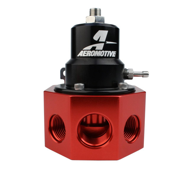 Aeromotive High-Performance Fuel System Parts, Aeromotive 13202 A2000 Carbureted Bypass Regulator - 4-Port, black and red fuel regulator with multiple connection ports for high-performance carbureted fuel systems. Aeromotive High-Performance Fuel System Parts, Aeromotive 13202 A2000 Carbureted Bypass Regulator - 4-Port, black and red fuel regulator with multiple connection ports for high-performance carbureted fuel systems.