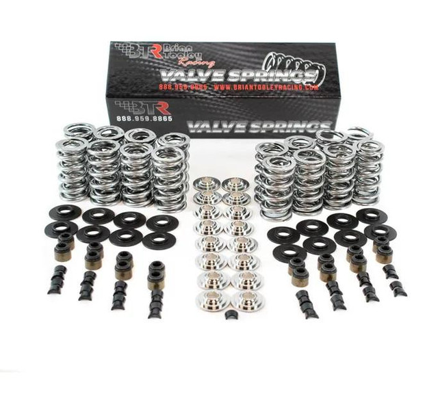 BTR LS DUAL .660 Spring Kit - Ti Retainers, automotive valve spring package with titanium retainers, valve springs, and installation components displayed in front of packaging box. BTR LS DUAL .660 Spring Kit - Ti Retainers, automotive valve spring package with titanium retainers, valve springs, and installation components displayed in front of packaging box.