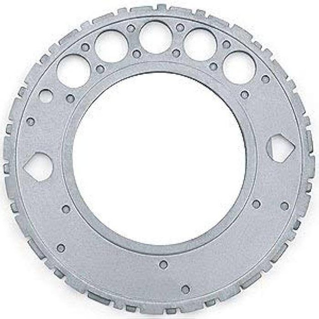 GM Performance GM 12559353 24x Reluctor Wheel, metallic gear-like component with multiple circular holes and notches around the edge. GM Performance GM 12559353 24x Reluctor Wheel, metallic gear-like component with multiple circular holes and notches around the edge.