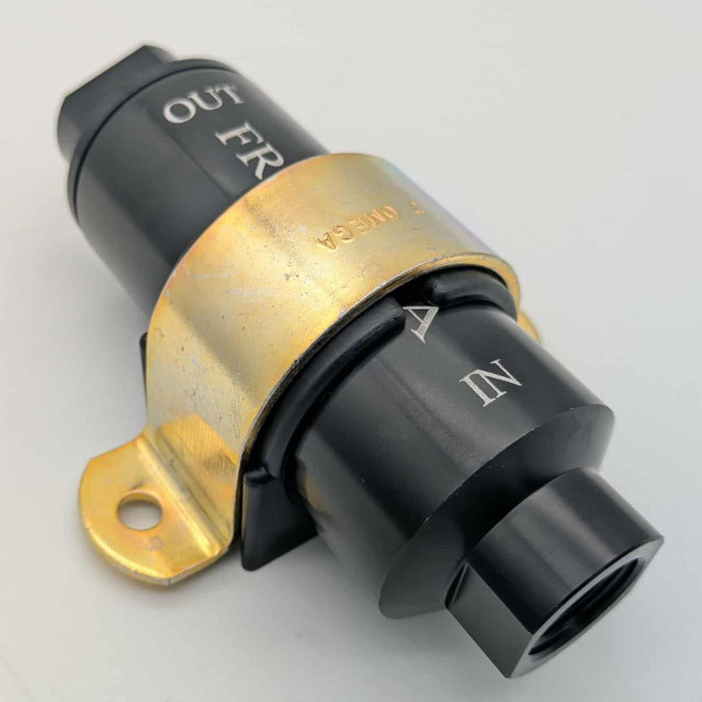 Scram Speed filter bracket - Large, close-up view of a black and gold fuel filter bracket with labeled connections for IN and OUT to ensure proper installation and performance.