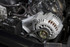 Holley Performance Parts – EFI, Intakes, & More LS Accessory System - P/S and Alt Bracket, close-up of engine components with alternator, pulley, and wiring.