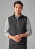 A black unisex reversible fleece vest displayed on a model, featuring a zip-up front and a simple design.
