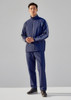 A model wearing unisex navy track pants paired with a matching zip-up jacket featuring white stripes.