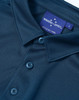 A navy blue men's sustainable jacquard knit short sleeve polo with a branded label and button details.