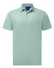 A short-sleeved polo in a soft mint green colour, featuring a collar and a logo at the neck.