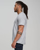 A grey men's premium cotton short sleeve tee shirt displayed on a model from the side, featuring a logo.