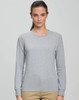 A long-sleeve tee shirt in light grey, featuring a round neckline and a fitted design. It has a logo on the chest.